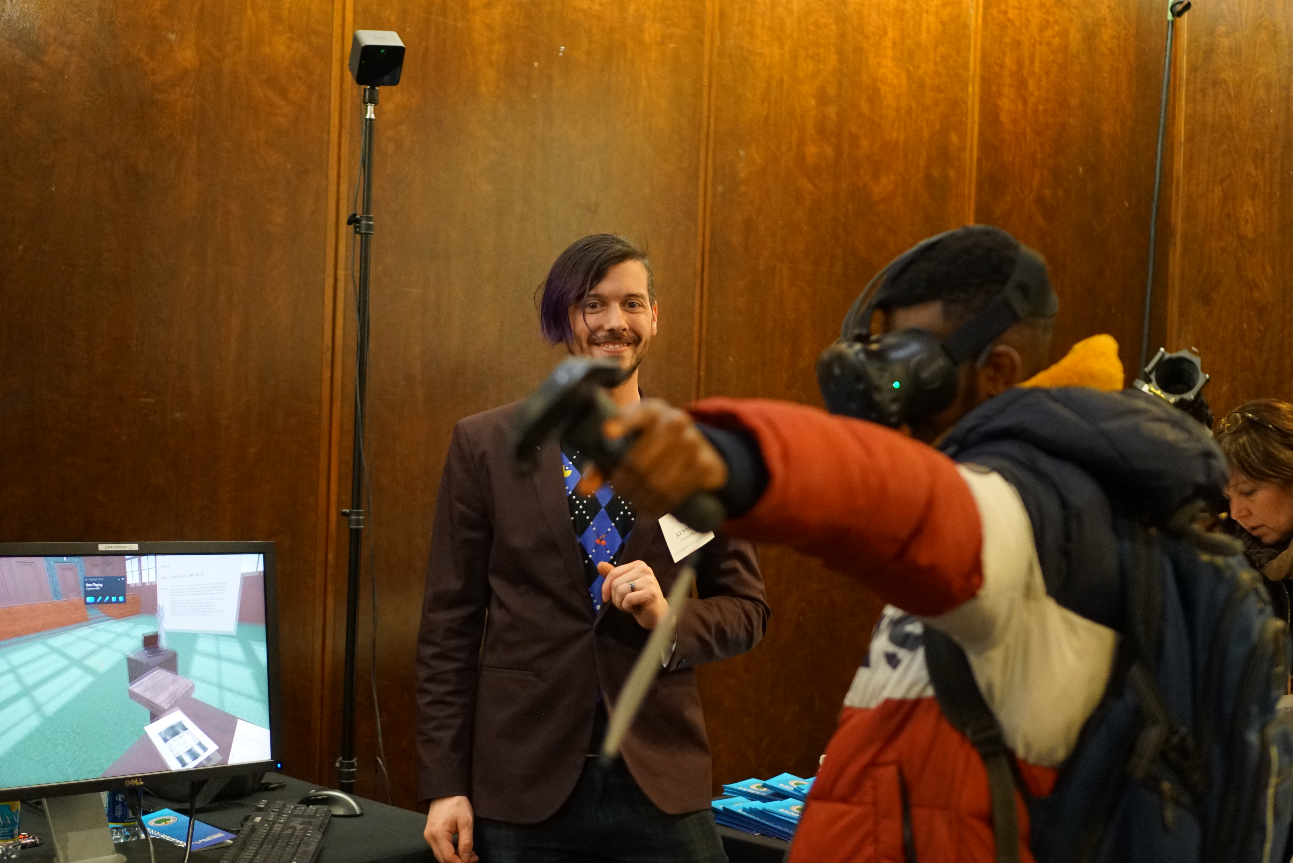 An attendee at ED Games Expo investigates objects in the courtroom as they explore an early proof-of-concept build.